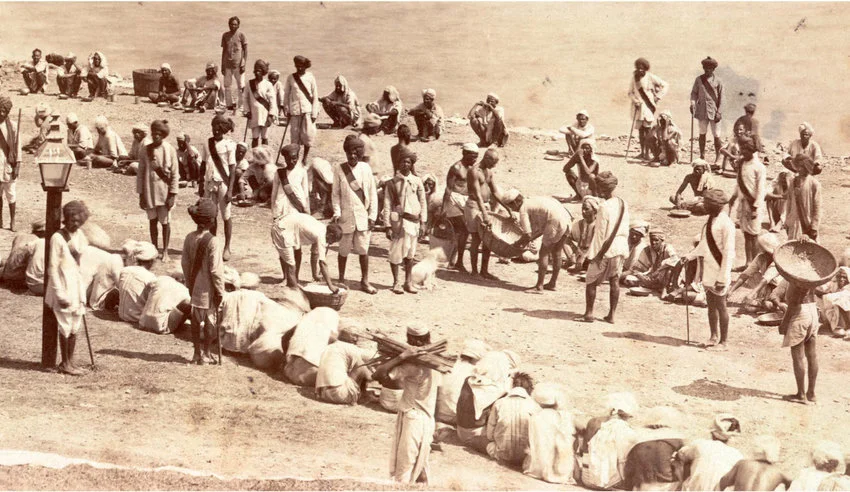 Prisoners in a penal colony being fed.