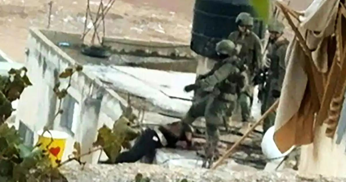 Israeli soldiers filmed kicking Palestinian bodies off rooftops.