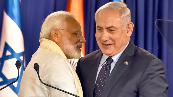 India's PM Narendra Modi, the Butcher of Gujarat, giving an uncomfortably close hug to PM Benjamin Netanyahu, the Butcher of Gaza.